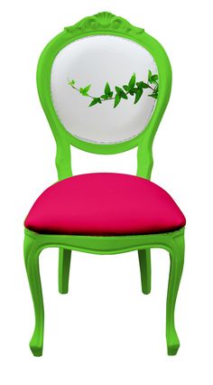 a green and pink chair with a mirror on it's back end, sitting in front of a white background