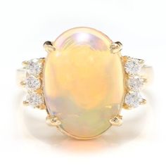 6.10 Carats Natural Impressive Ethiopian Opal And Diamond 14k Solid Yellow Gold Ring Suggested Replacement Value: $5,800.00 Total Natural Opal Weight Is: 5.80 Carats Opal Measures: 14.50 X 11.40mm Natural Round Diamonds Weight: .30 Carats (Color G-H / Clarity Si1-Si2) Top Of The Ring Measures: 17 X 14.84mm Ring Size: 6.5 (Free Re-Sizing Available) Ring Total Weight: 5.3 Grams Sku #Tf170 Etsy Gold Ring, Zircon Ring, Blue Zircon, Pinky Ring, Yellow Gold Ring, Natural Opal, Quality Diamonds, Solid Yellow, Womens Jewelry Rings