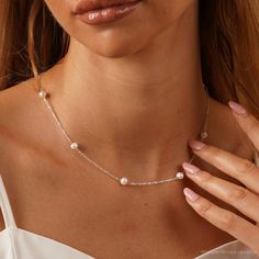 This exquisite jewelry made from genuine freshwater pearls is perfect for weddings. Its timeless elegance suits brides, bridesmaids, and the mother of the bride. Ideal for any special occasion, it adds a touch of sophistication and makes a cherished gift. F E A T U R E S * 100% Natural Freshwater Pearls * Material: 925 Sterling Silver * Finish: 925 Silver, 18K Gold A T T E N T I O N ♥ Please keep in mind that these are natural pearls. While I do my best to closely match each pair, they may not b Pearl White Dainty Bridal Necklace For Anniversary, Dainty Pearl White Bridal Necklace For Anniversary, Pearl Necklace For Bridesmaid Gift, Dainty White Gold Pearl Necklace For Wedding, Elegant Pearl Necklace For Bridesmaid Gift, Elegant Pearl Necklace For Bridesmaids, Elegant Pearl Necklace With Charm For Bridesmaid Gift, Pearl Necklace With Pendant For Bridesmaid Gift, Pearl Drop Necklace For Bridesmaid Gift