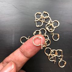 Sometimes SIMPLE is PERFECT. Small, dainty, and finished with latch backs, these tiny hoop earrings are the ear huggers minimalists can't help but gush over. [details] - 11 x 1.3mm (tiny)- 14k gold-filled or sterling silver- perfect for everyday wear- super comfortable (yes, you can sleep in them)- ONE-YEAR WARRANTY Minimalist Earrings Gold, Karma Necklace, Tiny Hoop Earrings, Gold Ring Stack, Earrings Minimalist, Huggie Hoop Earrings, Everyday Earrings, Gold Hoops, Ear Jewelry