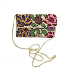 Women Handbag White Base With Multi Color Floral Design Beading Clutch  - Length: 26cm/10inches - Width: 15cm/6inches - Strap Length: 60cm/24inches - Main Color is Pearl White and other colours are Red, Maroon, Blue, Yellow, Green, Pink, Bronze, White, and Golden. - This clutch is hand made The materials are used in, Fabric, beads, Glass beads, Zip and Silk and Magnetic Snap Fastener. This clutches are made with love. A loveable gift for Weading, Anniversary, Birthday or any other occasions. Car Bohemian Embroidered Bags For Reception, Beaded Rectangular Bag For Reception, Rectangular Beaded Bag For Reception, Bohemian Beaded Bags For Celebration, Handmade Multicolor Shoulder Bag For Weddings, Beige Rectangular Evening Bag With Handwork, Traditional Embellished Beige Shoulder Bag, Beige Beaded Bags For Reception, Multicolor Rectangular Shoulder Bag For Celebration