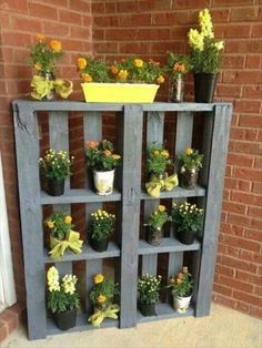 an old bookcase is filled with potted plants and other things to make it look like