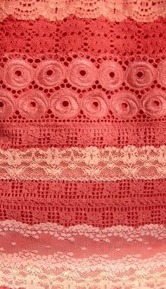 a red and white lace with circles on it