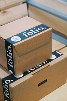 two boxes stacked on top of each other with the words tolo written on them