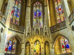 the inside of a church with stained glass windows