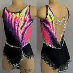 two mannequins wearing leotards with colorful designs on them