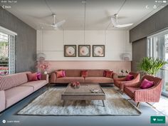 a living room filled with furniture and windows