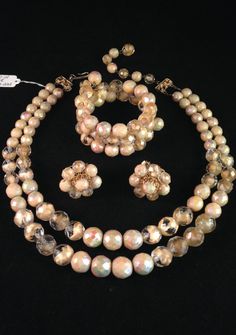 "This vintage cream-colored Hobé parure is made completely of faceted aurora borealis and clear artglass crystal beads...which does mean it is quite heavy and extremely well made! The chain-strung two-strand necklace measures appx 18 inches at the shortest strand including the 3\" glass bead extender. The earrings (and necklace) carry the traditional Hobé hallmark as well as the comfort rollers. They measure 1\" in diameter and all beads are securely fastened to a beautiful filigree back. The br Vintage Beige Party Jewelry, Vintage Beige Jewelry For Party, Beige Vintage Jewelry For Party, Cream Round Jewelry For Party, Ava Gardner, Floral Pins, Spring Ideas, Vintage Necklaces, Earrings And Necklace