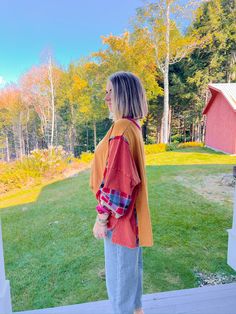 This long-sleeve gem features fun, multi-color patchwork sleeves and quarter-length button closure, giving it that effortlessly cool, layered look we crave this season. The oversized, high-low fit makes it perfect for everything from pumpkin patch adventures to cozy bonfires. Pair it with denim for a casual day out, shorts for warmer fall days, or leggings when you're ready to lounge in style. PRODUCT FIT - TRUE TO SIZE MODEL DETAILS - BRENNA IS WEARING A SIZE SMALL, 5'3" FABRIC CONTENT - 100% C Color Block Tops For Fall Layering, Orange Color Block Tops For Fall, Oversized Patchwork Tops For Fall, Fall Orange Color Block Tops, Oversized Patchwork Tops For Layering, Brown Patchwork Top For Fall, Fall Brown Patchwork Tops, Oversized Fall Color Block Outerwear, Cozy Color Block Tops For Fall