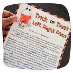 a trick or treat for left right game is being held by someone's hand