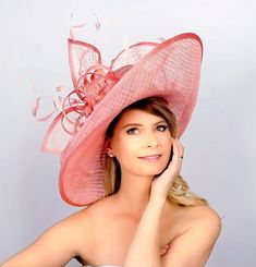 Made to order! Please order 2-3 weeks in advance prior to your event! Rushed orders are possible, please discuss! Absolutely stunning large up turned brim hat. This one is done in pink,  but taking orders for a wide variety of colors. Adorned with a large flower and feathers. This hat will definitely make a statement anywhere you go!! Not returnable due to the nature of this product All hats are custom made to fit your head size Fitted Pink Hat With Flat Brim, Pink Fitted Flat Brim Hat, Fitted Pink Hat With Curved Brim, Elegant Pink Hat With Short Brim, Elegant Pink Brimmed Hats, Fitted Pink Hat With Short Brim, Fitted Short Brim Pink Hat, Elegant Pink Mini Hat With High Crown, Pink Wide Brim Hat For Formal Occasions