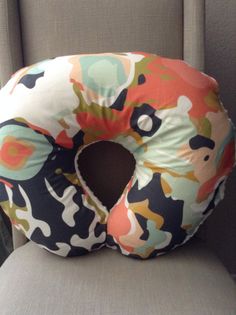 a pillow shaped like a donut sitting on top of a chair