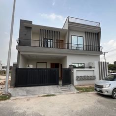 a car is parked in front of a house