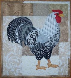 a close up of a rooster on a quilt