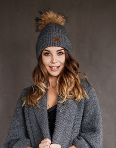 All our knitted hats are with 100% cotton lining so it's perfect for chilly spring weather. Wind resistant and the head is not sweating. Because of the lining hats don't stretch and keep its shape. Fur pom color can be a bit different because fur is natural and not colored. Material: 70% Merino wool, 30% alpaca wool Lining: 100% cotton Pom pom: Natural fur Colors available: Ivory, Black, White, Dark grey, Light grey, Dark blue, Red Sizes available: S 22 inches , 56/58 cm , M 23 inches, 58/60 cm Cable Knit Beanie For Fall, Soft Knit Winter Hats For Fall, Fall Cable Knit Beanie, Soft Knit Hat For Fall And Winter, Cold Weather Fall Hats For Winter Wear, Fall Cable Knit Hat, Gray Knitted Hat For Cold Weather, Knit Hats For Cold Weather In Fall, Cozy Hats For Cold Weather And Fall