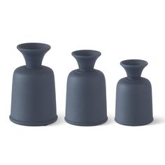 three gray vases sitting next to each other