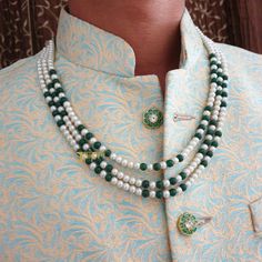 Indian Groom Pearl Necklace, Dulha Mala, Indian Wedding Men Jewelry, Sherwani Necklace For Groom, Indian Groom Jewelry, Pakistani Groom Mala 3 Layered Pearl Beads Necklace An elegant pearl beads necklace with the most stunning festoon. The perfect accessory for your occasion. This necklace is handcrafted with love Necklace Length: Choose from the drop-down menu (the length of the necklace in the image is 22 inches) Package: 1 Necklace Material: Premium Pearl beads, stone beads Care: Store in an airtight plastic bag or box. Keep away from water, moist place & fragrance For Express shipping, the option is available in the drop-down menu at checkout. If you need any help regarding placing an order or express shipping, feel free to message us DISCLAIMER: This product is made to order. Product White Temple Jewelry Mala For Weddings, Traditional White Wedding Mala, Traditional Green Kundan Necklace For Marriage, Traditional Green Necklaces For Marriage, Traditional White Bridal Necklace For Ceremonies, Green Mala Beads For Wedding, Green Round Beads Mala For Wedding, Green Mala For Wedding Festival Season, Traditional Bridal Necklace With Round Beads For Marriage