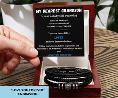 This bracelet is the perfect gift for your grandson's birthday, Christmas, graduation or any special occasion. It is a meaningful gesture that conveys your love and support. The adjustable size ensures a comfortable fit for his wrist, and the durable leather material guarantees long-lasting use. 👉Each bracelet comes engraved with a heartfelt message "Love you forever" ⭐️BRACELET DETAILS⭐️ - Total length: 8.3" (21 cm) - Engraved "love you forever" sentiment - Braided vegan leather band - Stainless steel decorative beads - Stainless steel magnetic clasp with black finish - Made to Order - Each bracelet comes with a gift box (you can elevate your presentation by upgrading to the mahogany-style luxury box, which features a brilliant LED spotlight.) ⭐️PRODUCTION TIME⭐️ Orders are being shipped Bracelet For Grandson, Engraved Leather Bracelets, Grandson Birthday, Decorative Beads, Luxury Boxes, Love You Forever, Braided Bracelets, Leather Band, Leather Material