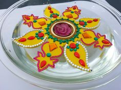 a decorated cake sitting on top of a glass plate