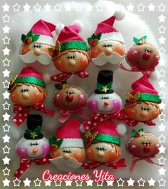 a group of christmas ornaments sitting on top of a white plate with red and green decorations