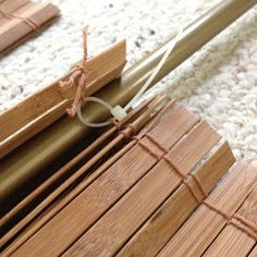 two pieces of wood sitting on top of a rug