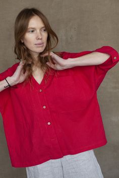 "A stylish oversize shirt with practical ¾ sleeves ended with cuffs. The shirt is designed to have a relaxed fit having a casual collarless silhouette. A dainty V-neck elongates the length of the neck. The shirt is decorated with big front pockets and nice noteworthy organic coconut buttons. The garment can be perfectly combined with various types of pants whether you prefer skinny or wide-leg designs. DETAILS ⚬ Decorated with handmade stitches. ⚬ V-neck. ⚬ Chest patch pockets. ⚬ 3/4 sleeves. ⚬ Oversized Linen Shirt, Linen Tunic Dress, Black Linen Dress, Linen Pajamas, Womens Blouses, Linen Tunic, Linen Blouse, Clothing Hacks, Type Of Pants