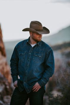 This premium Stetson Western shirt is constructed with triple needle stitching for toughness and has a classic, loose cut for riding and outdoor activity. It’s made from 100% cotton that hangs well while keeping its shape and only gets better with age. Western Style Medium Wash Shirt For Rodeo, Western Style Denim Blue Shirt For Rodeo, Cowboy Poses, Jason Roy, Hero Inspiration, Cowboy Stuff, Working Men, Western Denim Shirt, Hot Damn