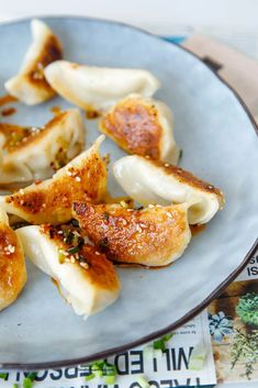 some dumplings are sitting on a plate