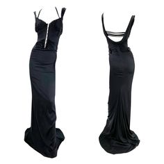 Iconic Tom Ford for Gucci Silk Stretch Black Corset Maxi Dress Gown F/W 2003 Runway Collection Italian size 38 This sexy dress features a corset top and cowl back with lots of strap and top-stitching details. Adjustable metal buckles engraved with Gucci name. Fastens at the back with a zip and at the front with hook and eyes. Made in Italy. Excellent Condition. Tom Ford For Gucci 90s, Gucci Fitted Evening Dress, Gucci Black Designer Dress, Tom Ford Gucci Runway, 90s Gucci By Tom Ford Black Dress, 2003 Runway, Tom Ford For Gucci, Tom Ford Dress, Tom Ford Gucci