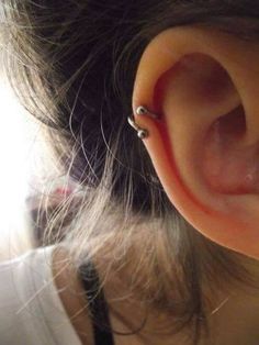 an ear piercing is seen in this image