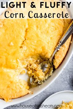 corn casserole in a white dish with a serving spoon and text overlay that reads, light & fluffy corn casserole