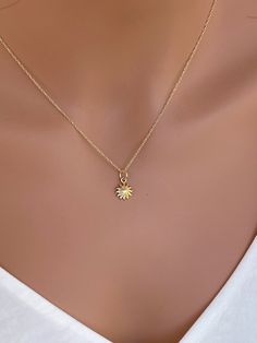 14k solid Gold Lotus Charm Necklace ... 14k yellow Gold Necklace with skinny 14k gold box chain . 14-karat yellow gold lotus blossom necklace features 14k solid gold component with solder jump ring, And 14k real gold cable chain or box chain or rope chain , choose from drop down box. ★★It consists of ... -14kt solid gold Mini 11.7 x 8.6mm Charm attaches onto -14k solid gold shinny Box chain or Cable chain or Rope chain . -Come up with beautiful ribbon gift box and -One set of Care instruction pa Tiny 14k Yellow Gold Charm Necklaces, Dainty 14k Gold Charm Necklaces, Dainty 14k Gold Charm Necklace Stamped 14k, Sunburst Necklace, Gold Sunburst, Gold Lotus, Ribbon Gift, 14k Yellow Gold Necklace, Lotus Blossom