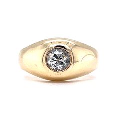 a yellow gold ring with a diamond in the center and an oval design on it