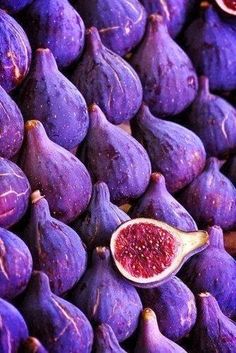 a pile of purple figs sitting next to each other