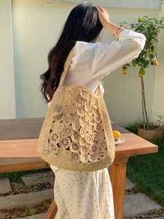 Indulge in luxury and elevate your style with our handmade raffia straw shoulder bag. With a boho design of circular and oval patches, this medium-sized tote exudes elegance and durability. The natural raffia color adds a touch of sophistication, while the shoulder strap allows for comfortable carrying. Perfect for any occasion, this bag is a must-have statement piece. Natural Soft Raffia Straw Handmade Unlined Inside pocket Size: 12"H x 9.5"W x 4"D Strap drop length: 12" Designer Style ID: 8619 Beige Straw Shoulder Bag With Round Handle, Spring Bohemian Hobo Bag In Natural Color, Beige Crochet Straw Bag With Round Handle, Bohemian Natural Hobo Bag For Spring, Bohemian Style Natural Hobo Bag For Spring, Spring Bohemian Natural Hobo Bag, Straw Bag With Round Handle For Beach, Woven Jute Shoulder Bag, Bohemian Jute Shoulder Bag For Shopping