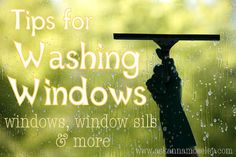 a hand holding up a window with the words tips for washing windows in front of it