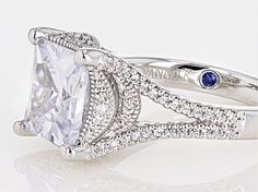 Pre-Owned Vanna K ™ for Bella Luce ® white diamond simulant 6.32ctw square and round, Platineve® ring. Measures approximately 0.44"L x 0.13"W and is not sizeable. Each Vanna K™ design has a signature label that features a lab created sapphire. The diamond equivalent weight is 4.52ctw..  This product may be a customer return, vendor sample, or on-air display and is not in its originally manufactured condition.  It may not be new.  In some instances, these items are repackaged by JTV. White Square Cut Fine Jewelry For Wedding, White Diamond Ring With Vs Clarity And Radiant Cut, White Diamond Cut Square Cut Ring, Dazzling White Square Cut Diamond Ring, White Rings With Center Stone Square Cut, White Square Cut Diamond Ring With Vs Clarity, Elegant Square Cut Diamond Ring With Vs Clarity, White Square Cut Rings With Diamond Accents, Diamond Simulant