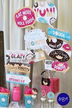 a table topped with lots of donuts and candy