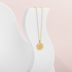 A trendy necklace that never goes out of style. The PAVOI 14K gold plated engraved coin pendant features a byzantine-style coin with a reversible design, showcasing a moon and star on one side and a sun and moon on the other. Hanging on a cable chain, this pendant necklace adds the perfect boho-chic touch. Materials: Measurements: Chain Length: 20"+ adjustable chain slide. Pendant size is 18mm (.7") diameter. Trendy Necklace, Great Gifts For Mom, Moon And Star, Bohemian Necklace, Trendy Necklaces, Sun And Moon, Coin Necklace, Coin Pendant, Out Of Style