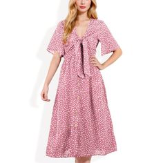 The Anna-Kaci Women's Polka Dot Midi Dress combines a playful polka dot print with timeless elegance. Featuring a stylish front tie detail and a button-front design, this dress offers a flattering silhouette that enhances your figure. The lightweight fabric and short sleeves make it comfortable for warm-weather wear, while the midi length adds a touch of sophistication. Ideal for casual outings, brunch dates, or special occasions, this versatile dress is a must-have for any wardrobe. Polka Dot Dress With Button Closure For Spring, Polka Dot Midi Dress With Buttons For Spring, Polka Dot Dresses With Buttons And Short Sleeves, Casual Polka Dot Dress With Button Closure, Polka Dot Summer Dresses With Button Closure, Polka Dot Summer Dress With Buttons, Summer Polka Dot Dress With Buttons, Polka Dot Spring Dress With Buttons, Polka Dot Dress With Buttons For Day Out