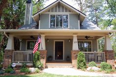 a house with an american flag on the front porch