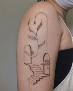 a woman with a tattoo on her arm that has stairs leading up to a tree