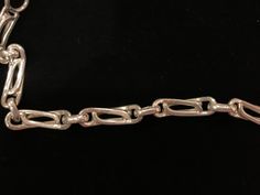 Beautiful vintage sterling silver chain link bracelet with a snap-lock closure. The bracelet has a beautiful design. It measures 8.25 inches in length. There are a few minor superficial scratches. Formal Chain Link Bracelet With Hook And Links, Formal Sterling Silver Link Bracelet With Chain Detail, Formal Sterling Silver Link Bracelet, Formal Silver Chain Link Bracelet, Silver Chain Link Bracelet For Formal Occasions, Formal Chain Link Bracelet With Clasp, Formal Link Chain Bracelet With Clasp, Formal Link Chain Bracelet With Sterling Silver Clasp, Formal Silver Chain Bracelet With Oval Links