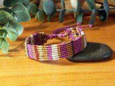 🌊 This macramé bracelet is a 𝗼𝗻𝗲-𝗼𝗳-𝗮-𝗸𝗶𝗻𝗱 accessory that 𝗳𝗲𝗮𝘁𝘂𝗿𝗲𝘀 an ethnic patchwork style and is crafted from tiny threads. Not only is it 𝘂𝗻𝗶𝗾𝘂𝗲 and eye-catching, but it is also 𝘄𝗮𝘁𝗲𝗿𝗽𝗿𝗼𝗼𝗳, making it the perfect accessory for any occasion. ◼️ 𝗪𝗛𝗬 𝗗𝗢 𝗬𝗢𝗨 𝗡𝗘𝗘𝗗 𝗧𝗛𝗜𝗦? This one-of-a-kind macramé bracelet is not just an accessory, it's a color expression for the wearer. Crafted using recycled threads, this bracelet features purple and earthy color Cheap Bohemian Purple Friendship Bracelets, Bohemian Multicolor Braided Bracelets In Waxed Cord, Multicolor Bohemian Braided Bracelets In Waxed Cord, Bohemian Multicolor Waxed Cord Braided Bracelets, Bohemian Multicolor Braided Waxed Cord Bracelets, Bohemian Beaded Bracelets With Waxed Cord For Festivals, Bohemian Multicolor Friendship Bracelets With Waxed Cord, Bohemian Multicolor Waxed Cord Friendship Bracelets, Bohemian Multicolor Waxed Cord Friendship Bracelet