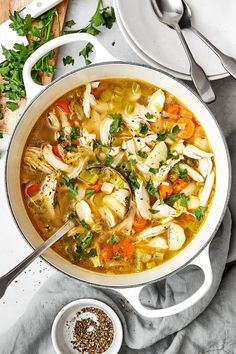 a pot filled with chicken and vegetable soup