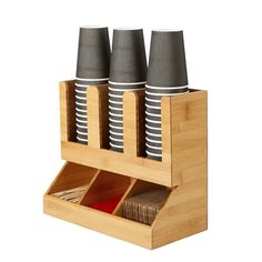 three cups in a bamboo holder on a white background