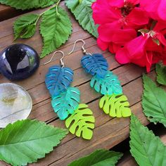 "Add a ton of Tropical FUN to your summertime outfits when you wear these Monstera Tropical Leaves Cascading Dangle Earrings! 💚 Each Monstera Inspired Leaf Pendant is made from double sided matte textured semi-translucent Teal, Green, & Chartreuse laser cut acrylic! So Lightweight - You'll barely know they are there! 💚 3 Colors of Cascading Tropical leaves measure about .75\" wide and flow 2.75\" long. Swaying with your every step, you get to pick which earring hooks these are made with! P Tropical Earrings, Green Chartreuse, Summertime Outfits, Resin Accessories, Beach Necklace, Big Leaves, Laser Cut Acrylic, Summer Color, Monstera Leaf