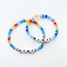 "Treat yo' self or your best mom friend to a cute, colorful bracelet set with MAMA and MINI brightly beaded! Length and text fully customizable.  Stackers will coordinate evenly with bracelet sizes selected unless otherwise requested.  Sets may be MAMA/MINI, two adults, or two kids. Please indicate your choice in order personalization notes.  Standard lengths are 7\" for women, 8\" for men, 5.5\" for kids. **Please double check all personalization details and requests. All bracelets are custom made to order and all sales are final. **Treat jewelry with care and avoid exposure to water, chlorine, salt, and direct sunlight to prevent damage or fading. **Supervise babies and young children when wearing bracelets. Any small items can be choking hazards. Do not let the child put the jewelry in Wearing Bracelets, Mama And Mini, Colorful Bracelet, Mom Friend, Beste Mama, Letter Beads, Friends Mom, Name Bracelet, Colorful Bracelets