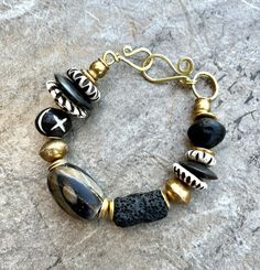 Boho Chic Bracelet Black Lava Rock African Tribal Brass and Batik Bone Beads African Beaded Jewelry, Witchy Whimsical, African Beaded Bracelets, Bohemian Chic Jewelry, African Brass Beads, Statement Bracelets, Bracelet Materials, Tassel Necklace Boho, Queens Jewels