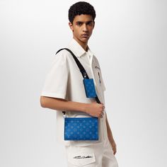 LOUIS VUITTON® - Gaston Wearable Wallet - Agave Blue Luxury Blue Travel Pouch, Designer Blue Bags With Card Slots, Blue Designer Bags With Card Slots, Designer Blue Wallet For Everyday Use, Contactless Payment, Bags Louis Vuitton, Luxury Wallet, Louis Vuitton Official, Men's Collection